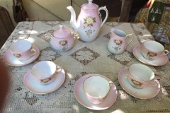 Child's Pink and White Tea Set with yellow and blue flowers