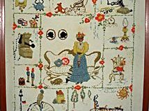 Antique items on a motto/sampler